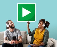 Interracial couple listening to music and holding a play button