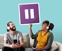 Interracial couple listening to music and holding a pause button