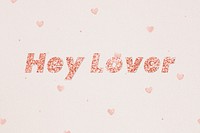 Glittery hey lover typography on heart patterned background