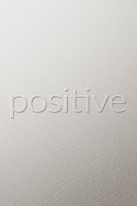 Positive embossed font white paper background