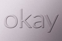 Word okay emboss typography on paper texture