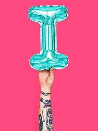 Hand holding balloon letter I