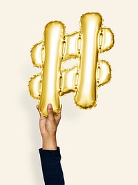 Hand holding balloon symbol hashtag #