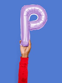 Hand holding balloon letter