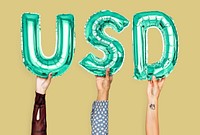 Hands holding USD word in balloon letters