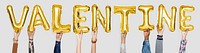 Yellow gold alphabet balloons forming the word valentine