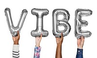 Gray silver alphabet balloons forming the word vibe