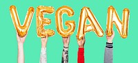 Hands holding vegan word in balloon letters