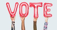 Hands holding vote word in balloon letters