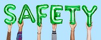 Green alphabet balloons forming the word safety