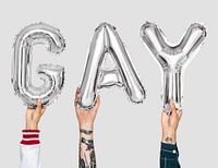 Silver gray alphabet balloons forming the word gay