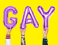 Purple alphabet balloons forming the word gay