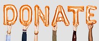 Orange alphabet balloons forming the word donate