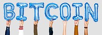 Hands holding balloons spelling Bitcoin