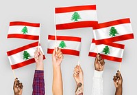 Hands waving flags of Lebanon