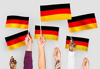 Hands waving the flags of Germany