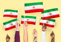 Hands waving the flags of Iran