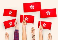 Hands waving flags of Hong Kong