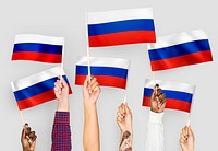 Hands waving the flags of Russia