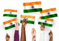 Hands waving flags of India