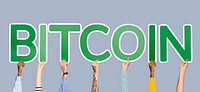 Hands holding up green letters forming the word bitcoin