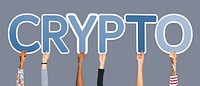 Hands holding up blue letters forming the word crypto