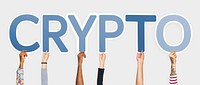 Hands holding up blue letters forming the word crypto