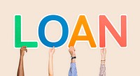 Hands holding up colorful letters forming the word loan