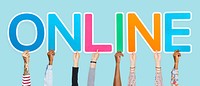 Hands holding up colorful letters forming the word online<br />