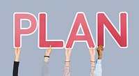 Hands holding up red letters forming the word plan