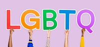 Hands holding the abbreviation LGBTQ