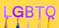 Hands holding the abbreviation LGBTQ