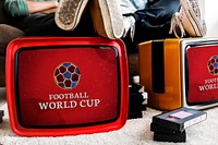 Retro televisions with a live football match