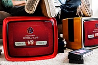 Retro televisions with a live football match