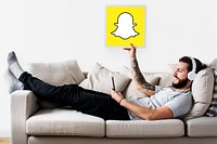 Man showing a Snapchat icon
