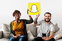 Couple showing a Snapchat icon