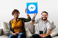 Couple showing a Facebook Messenger icon