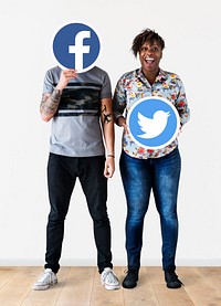 People holding two social media icons
