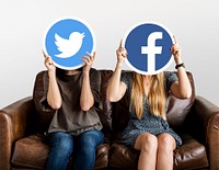 Women holding social media icons