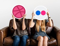 People holding social media icons<br />