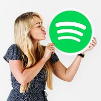 Woman holding up a Spotify icon isolated