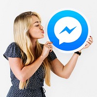 Woman blowing a kiss to a Facebook Messenger icon
