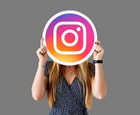 Woman showing an Instagram icon