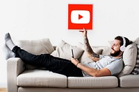 Man holding a YouTube icon