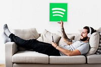 Man holding a Spotify icon