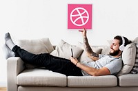 Man holding a Dribbble icon