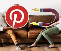 People holding a Pinterest icon