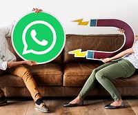 People holding a WhatsApp Messenger icon