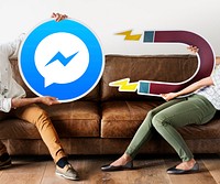 People holding a Facebook Messenger icon