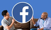 Men showing a Facebook icon